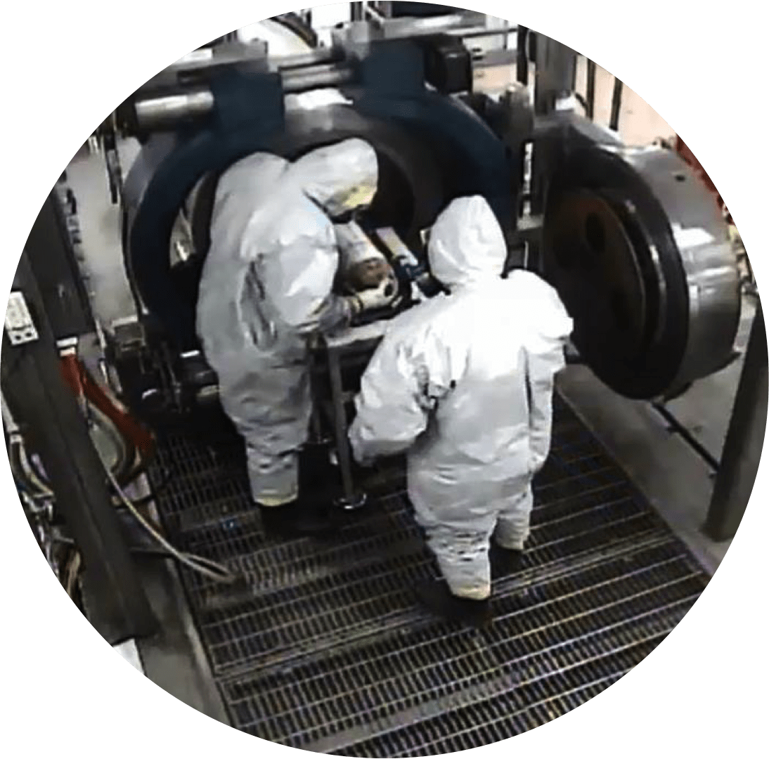 Pueblo chemical agent-destruction pilot plant explosive destruction system, or PCAPP EDS, operators place a bottle containing mustard agent in the Munitions Holder for destruction, March 18, 2015. After safe detonation, the bottle, which will be a metal fragment, is removed from the vessel. (U.S. Army Photo) 